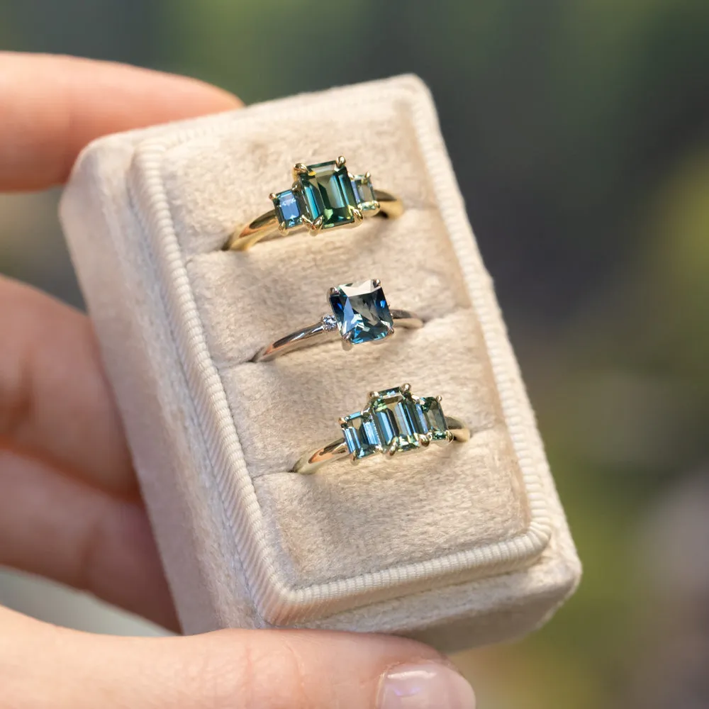 1.30ct Emerald Cut Madagascar Sapphire and  0.98ctw Montana Sapphire Three Stone Low Profile Ring in 18k Yellow Gold