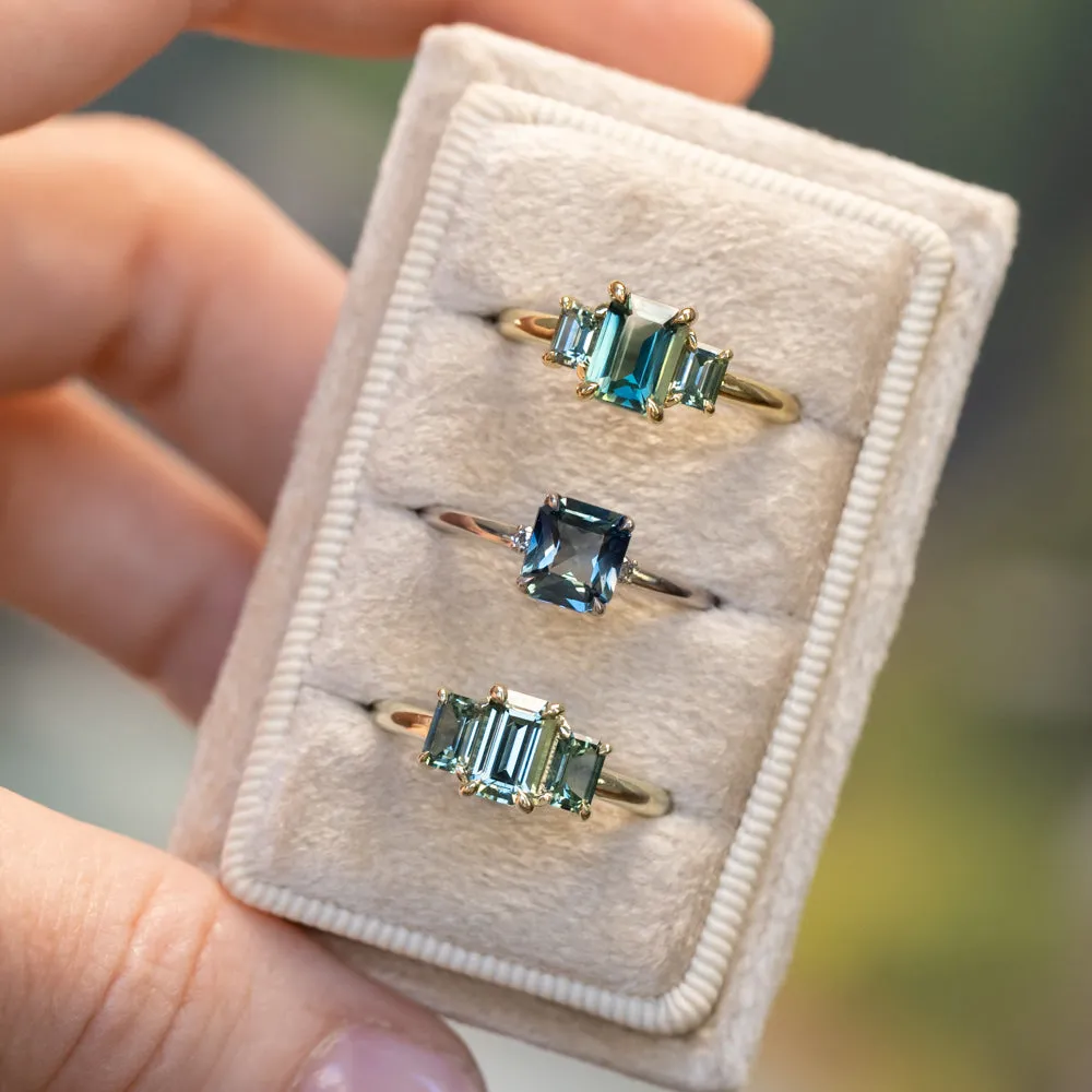 1.30ct Emerald Cut Madagascar Sapphire and  0.98ctw Montana Sapphire Three Stone Low Profile Ring in 18k Yellow Gold